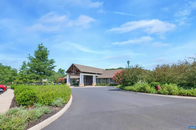 a view of a chairs and table in backyard