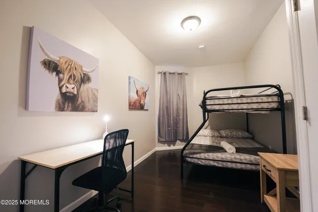 a bedroom with a bed and a desk