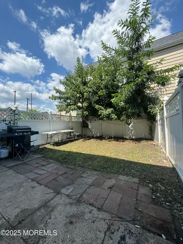 a view of a yard with an outdoor space