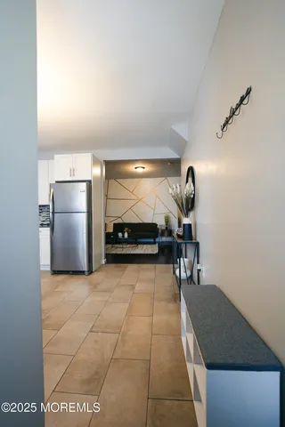 a lobby with furniture and a rug