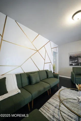 a bedroom with furniture and a wooden floor