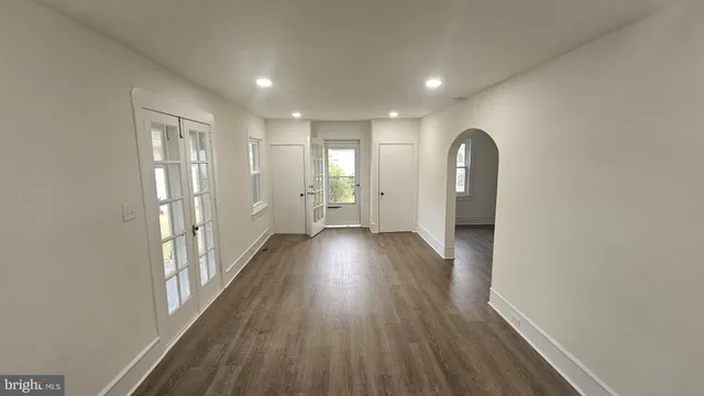 a view of gallery with wooden floor