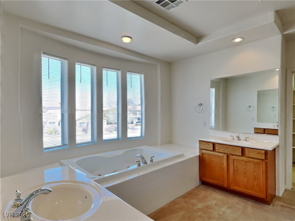 9456 Bluff Ledge Avenue Las Vegas, NV 89149 - Photo 11 of 35 Full bath featuring vanity, recessed lighting, and a jetted tub