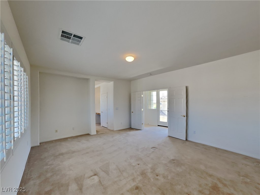 9456 Bluff Ledge Avenue Las Vegas, NV 89149 - Photo 13 of 35 Carpeted empty room featuring baseboards