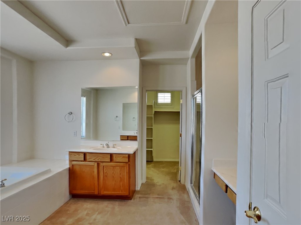 9456 Bluff Ledge Avenue Las Vegas, NV 89149 - Photo 10 of 35 Full bath featuring vanity, a shower stall, a bath, a walk in closet, and recessed lighting