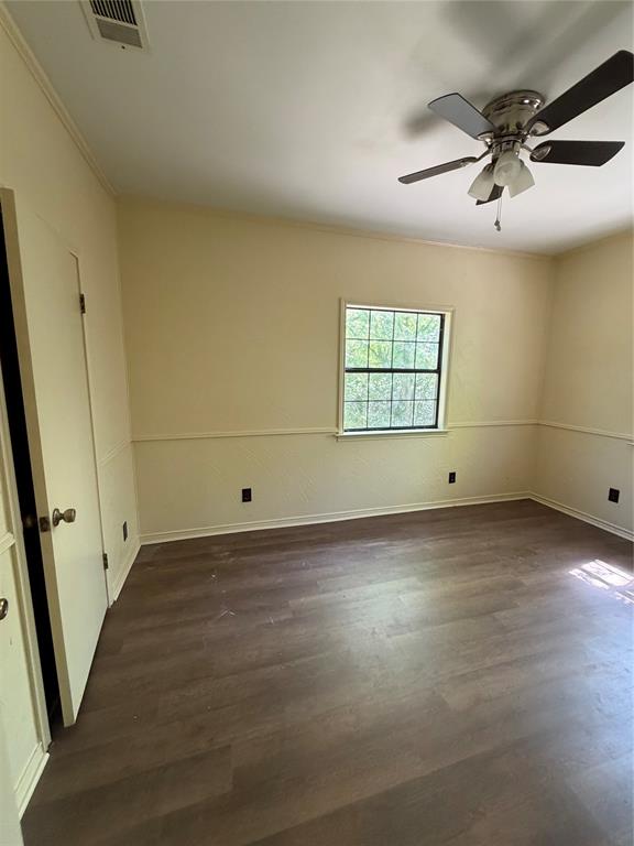 257 West Acres Road Gun Barrel City, TX 75156 - Photo 13 of 22 en empty room with windows and ceiling fan