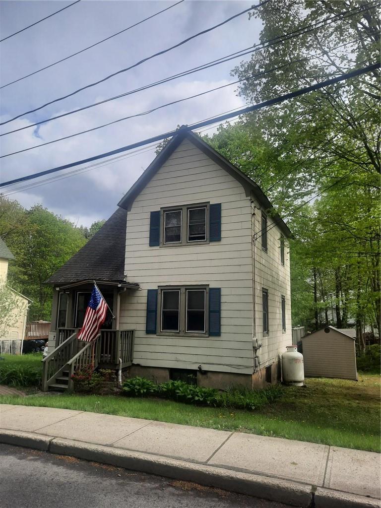 72 Smith Clove Road Central Valley, NY 10917 - Photo 1 of 1 a front view of a house with a yard and garage