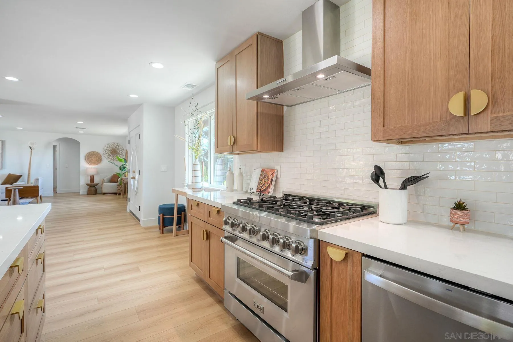 1870 Laurel Road Oceanside, CA 92054 - Photo 12 of 57 a kitchen with stainless steel appliances granite countertop a stove a sink and a microwave