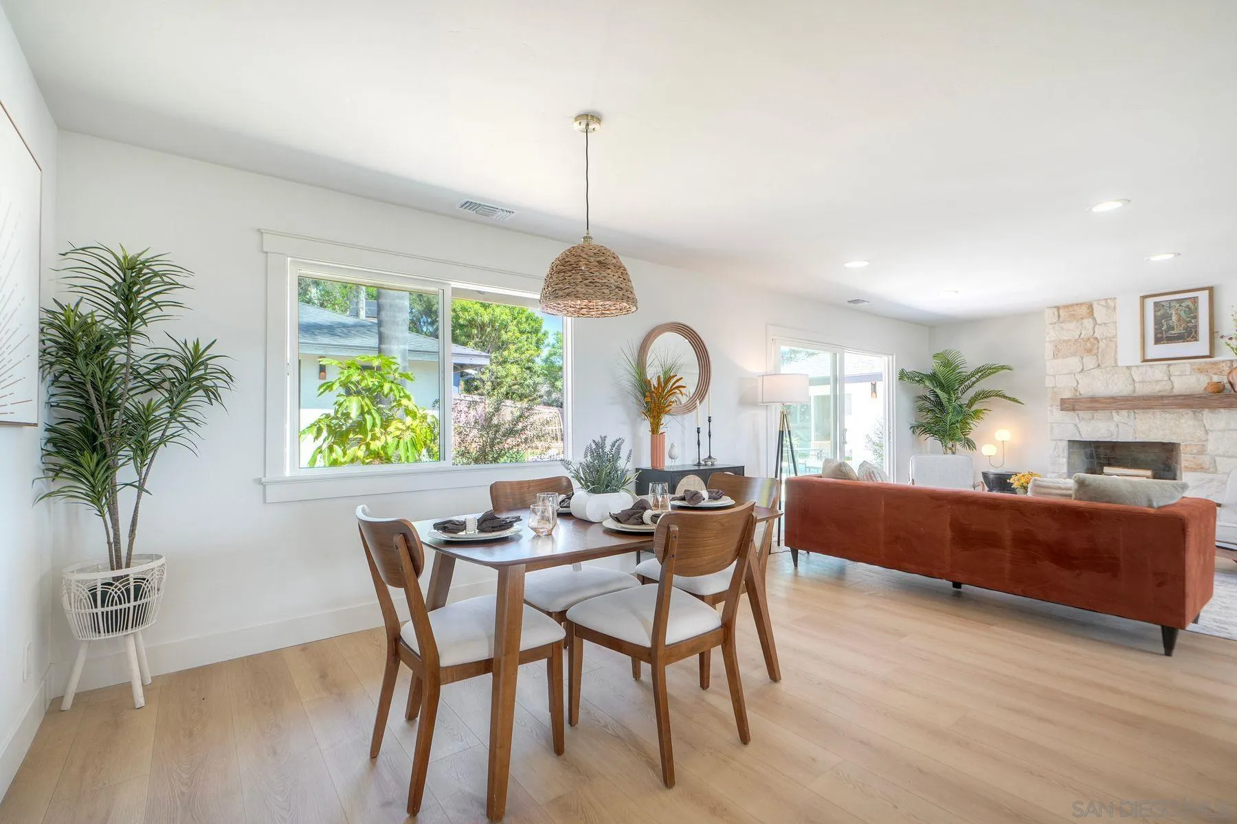 1870 Laurel Road Oceanside, CA 92054 - Photo 16 of 57 a view of a dining room with furniture window and wooden floor