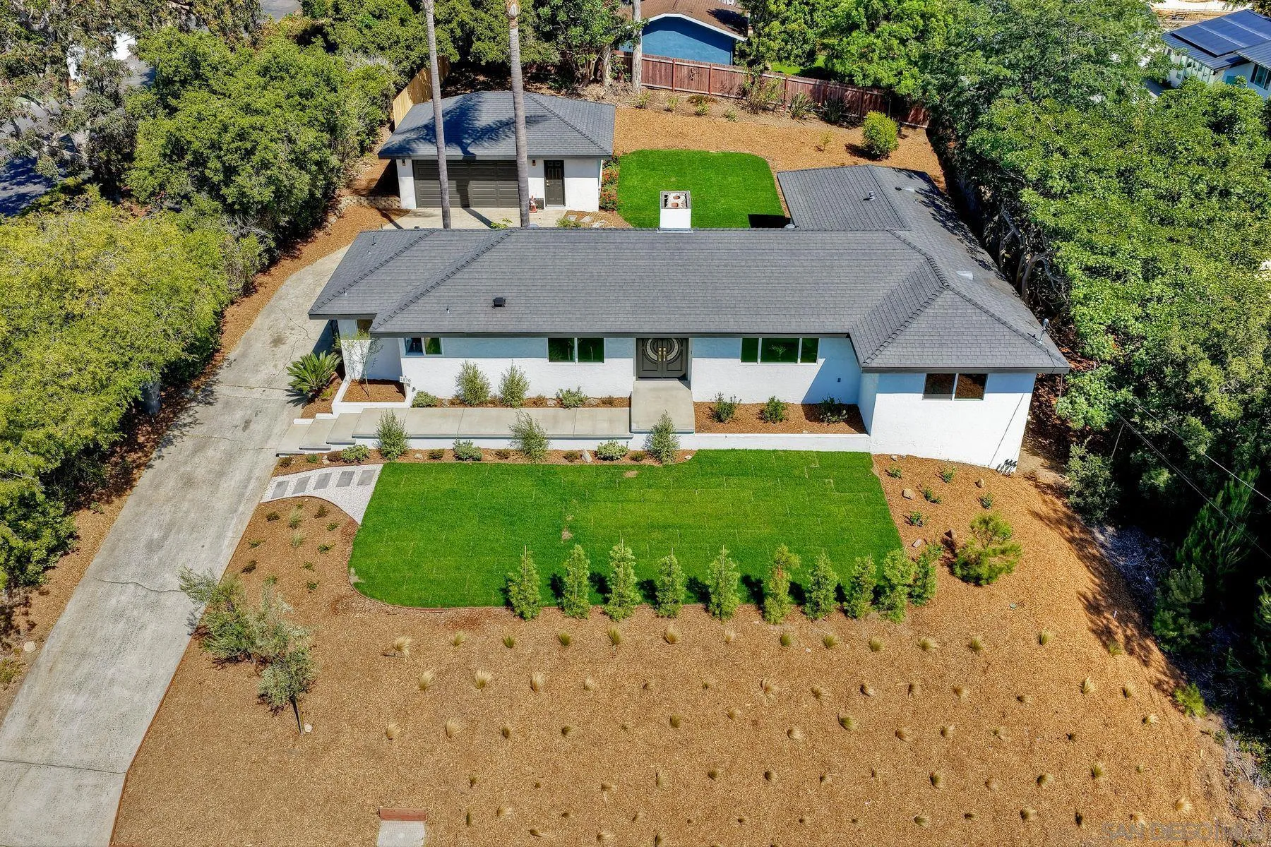 1870 Laurel Road Oceanside, CA 92054 - Photo 2 of 57 a front view of a house with a yard