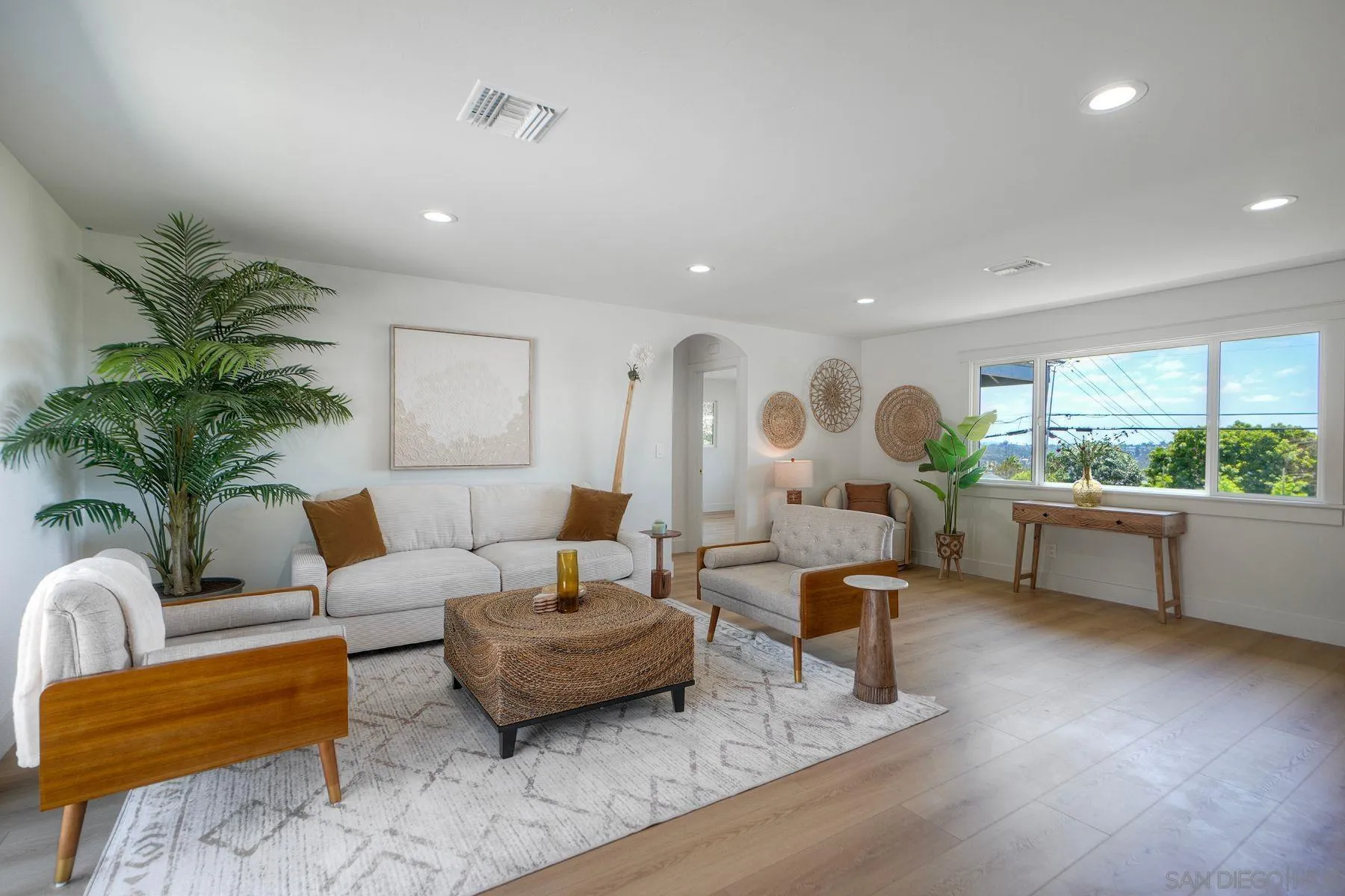 1870 Laurel Road Oceanside, CA 92054 - Photo 22 of 57 a living room with furniture and a large window