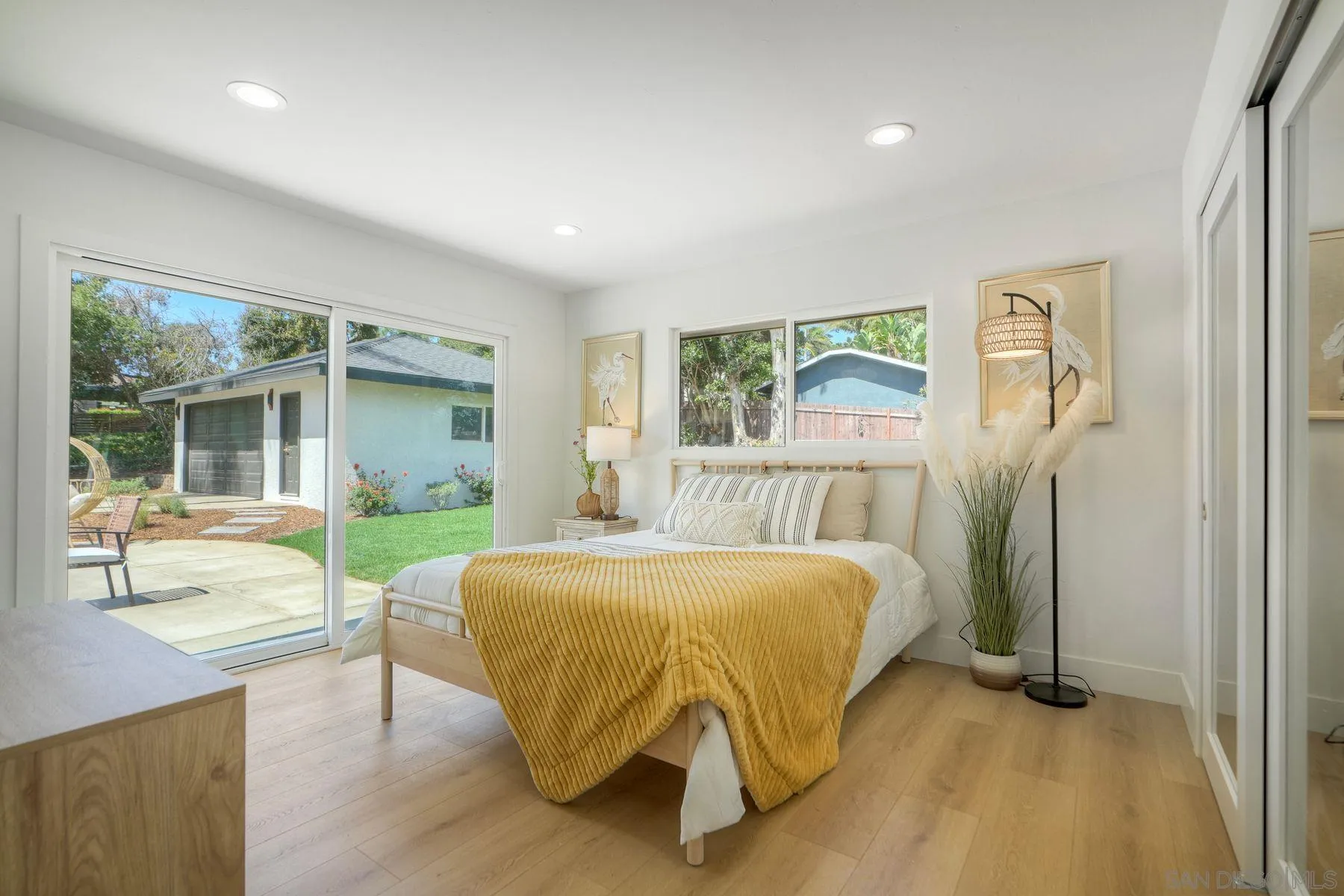 1870 Laurel Road Oceanside, CA 92054 - Photo 24 of 57 a bedroom with a bed and a large window