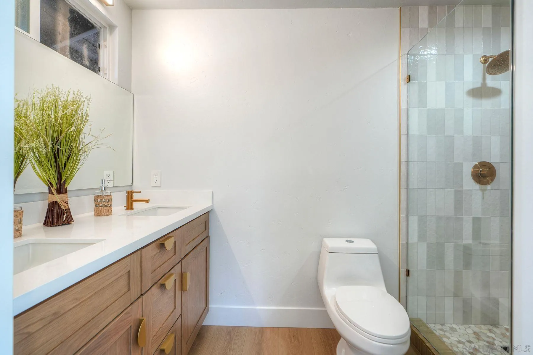 1870 Laurel Road Oceanside, CA 92054 - Photo 26 of 57 a bathroom with a toilet sink and shower