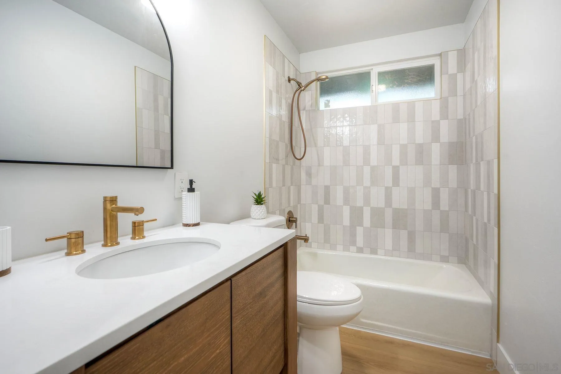 1870 Laurel Road Oceanside, CA 92054 - Photo 29 of 57 a bathroom with a sink a toilet and a bathtub