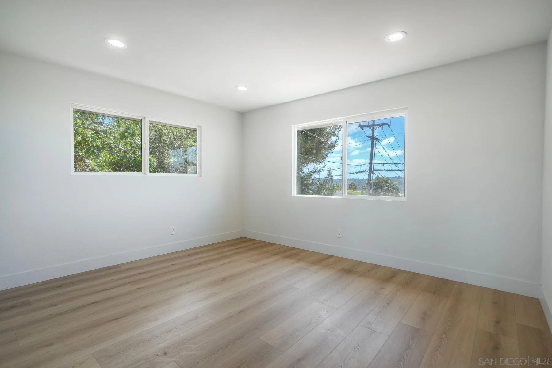 1870 Laurel Road Oceanside, CA 92054 - Photo 30 of 57 a view of an empty room with wooden floor and a window