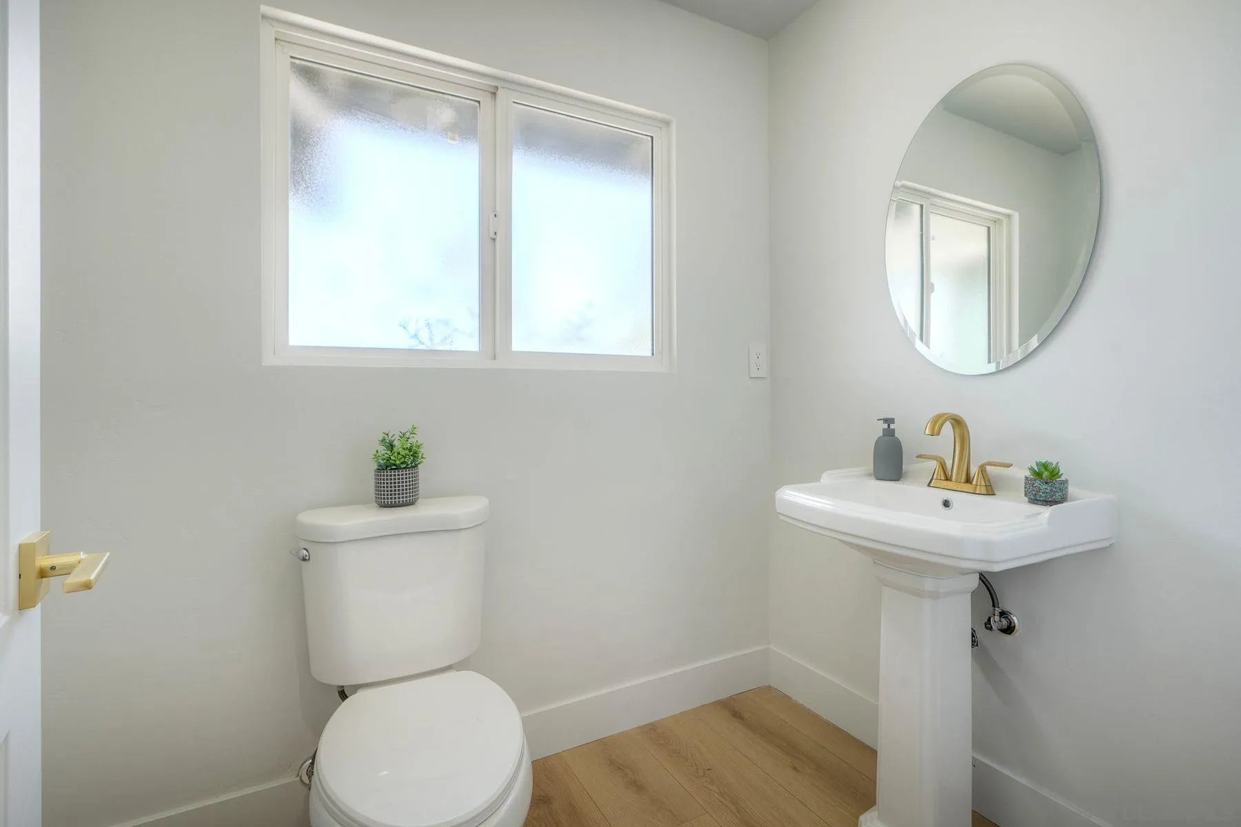 1870 Laurel Road Oceanside, CA 92054 - Photo 31 of 57 a bathroom with a toilet a sink and a mirror
