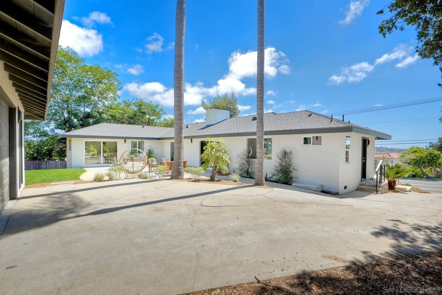 1870 Laurel Road Oceanside, CA 92054 - Photo 38 of 57 a view of a house with a patio and a yard
