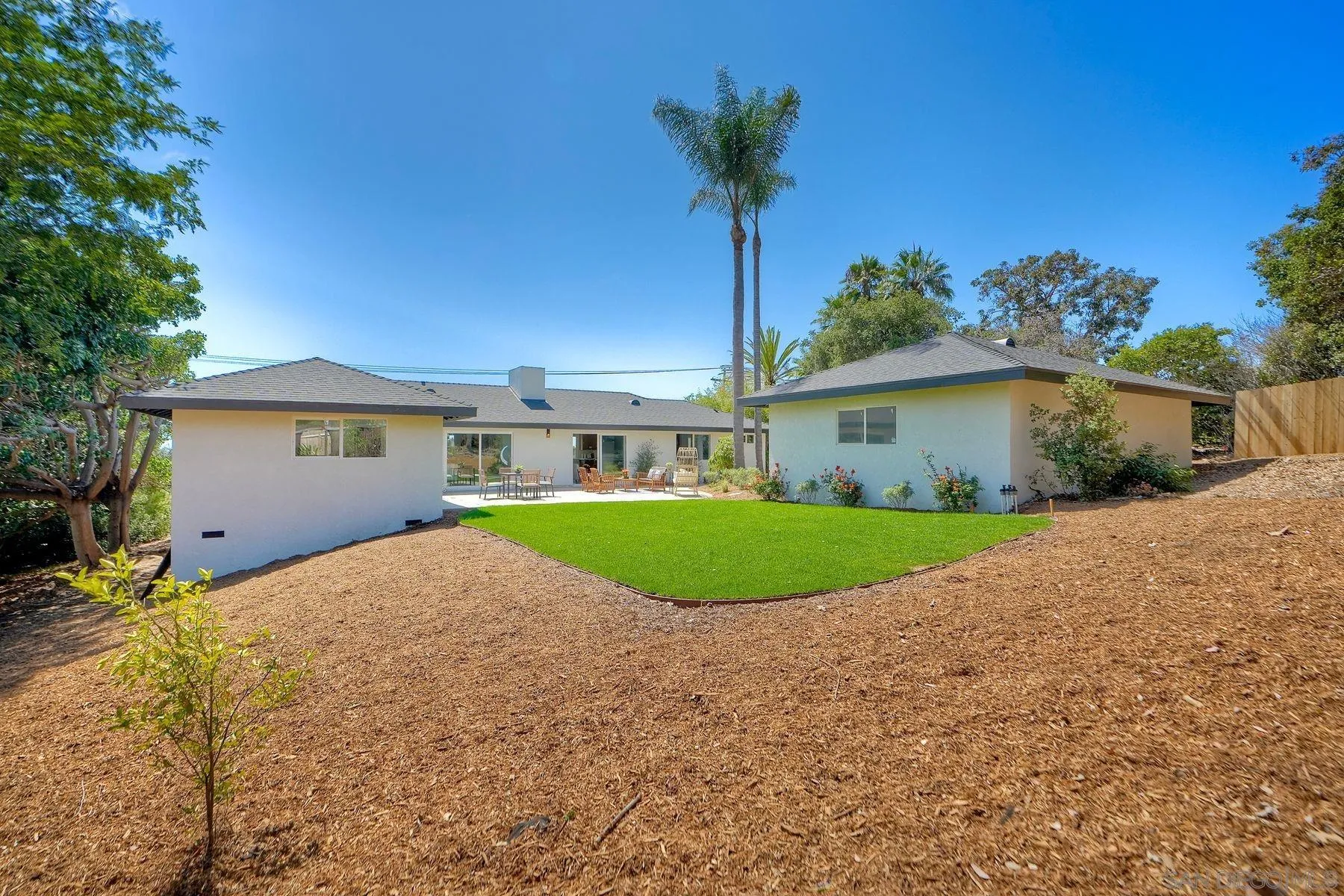 1870 Laurel Road Oceanside, CA 92054 - Photo 43 of 57 a front view of a house with a yard and potted plants