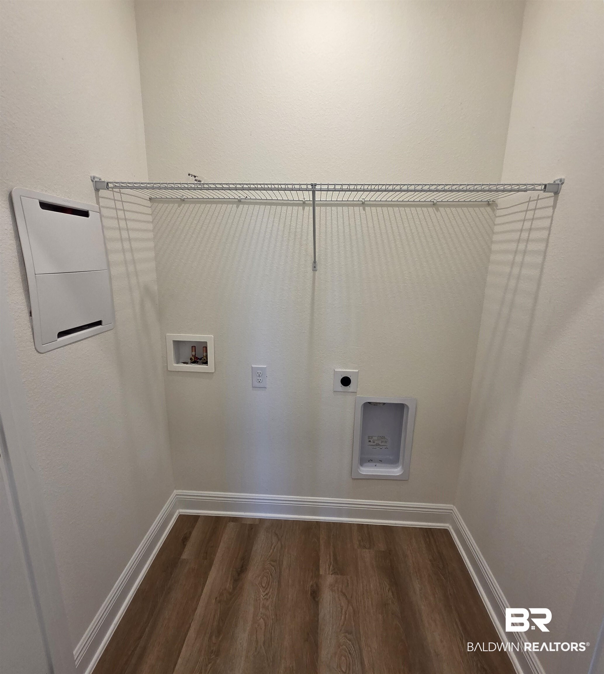 28084 Hallow Trail Elberta, AL 36530 - Photo 16 of 21 Laundry room with dark wood finished floors, hookup for a washing machine, hookup for an electric dryer, and a textured wall