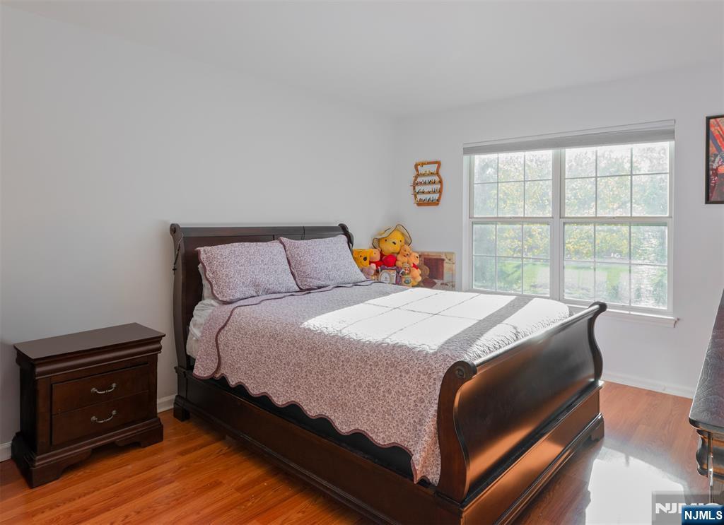 11 Parkside Court Wayne, NJ 07470 - Photo 15 of 22 a bedroom with a bed and a window