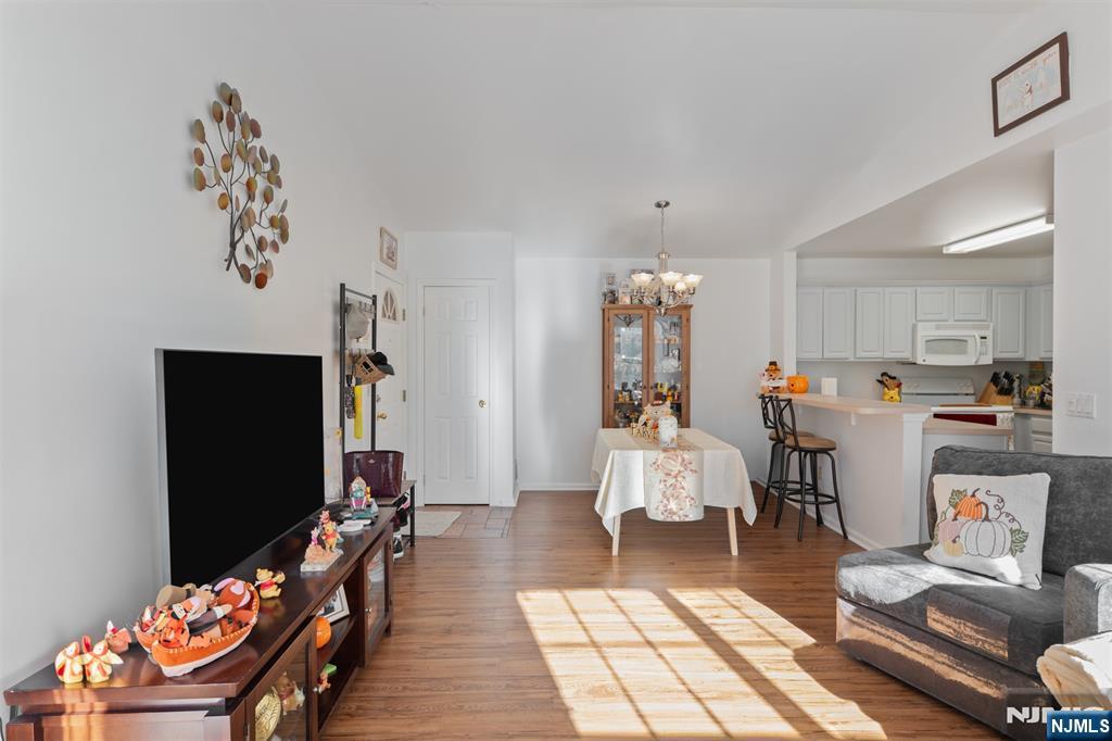 11 Parkside Court Wayne, NJ 07470 - Photo 7 of 22 a living room with furniture and a flat screen tv