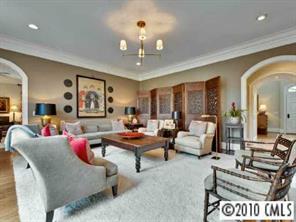 2952 Wheelock Road Charlotte, NC 28211 - Photo 4 of 8 a living room with furniture and a chandelier