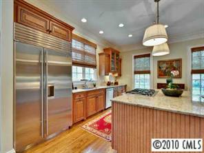 2952 Wheelock Road Charlotte, NC 28211 - Photo 5 of 8 a kitchen with a sink refrigerator and cabinets