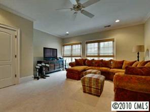 2952 Wheelock Road Charlotte, NC 28211 - Photo 7 of 8 a living room with furniture and a flat screen tv
