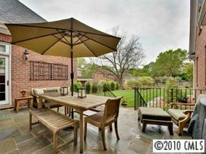2952 Wheelock Road Charlotte, NC 28211 - Photo 8 of 8 a view of a patio with a table and chairs under an umbrella