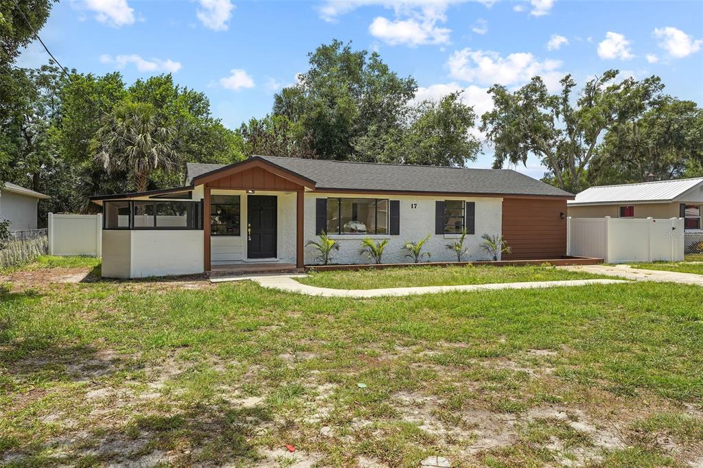 17 Palmira Road DeBary, FL 32713 - Photo 4 of 28 a front view of a house with a garden