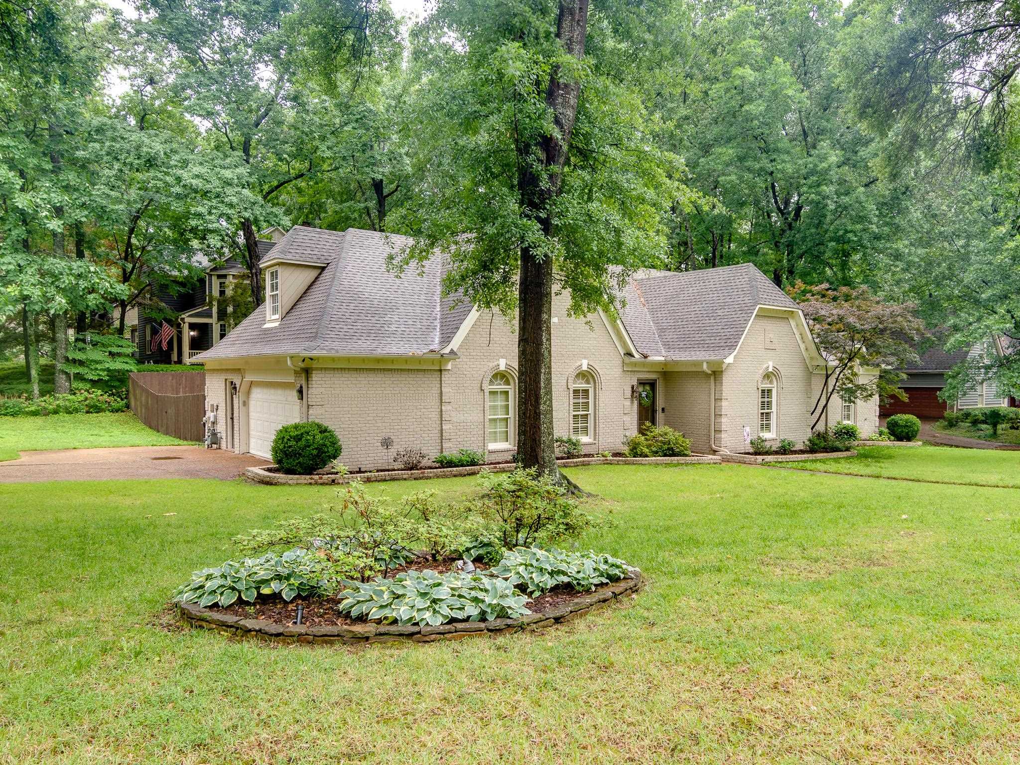 791 North Tree Drive Collierville, TN 38017 - Photo 27 of 27 Light-colored brick exterior featuring multiple gables and dormer windows