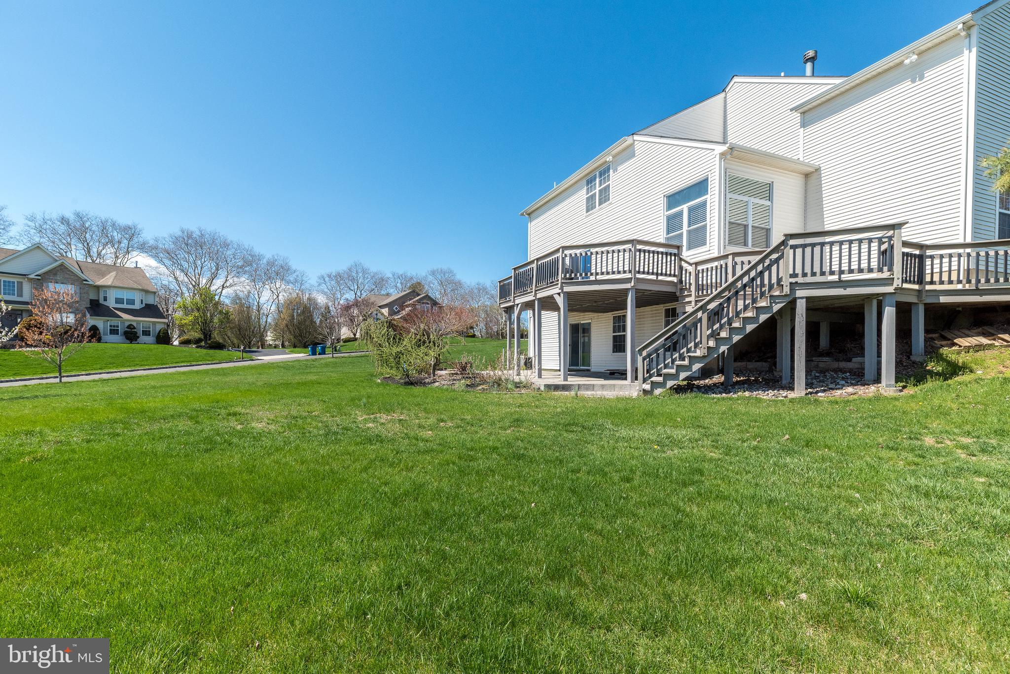 201 Summer Ridge Circle Chalfont, PA 18914 - Photo 13 of 94 Stairs from deck leading to the paved lower level