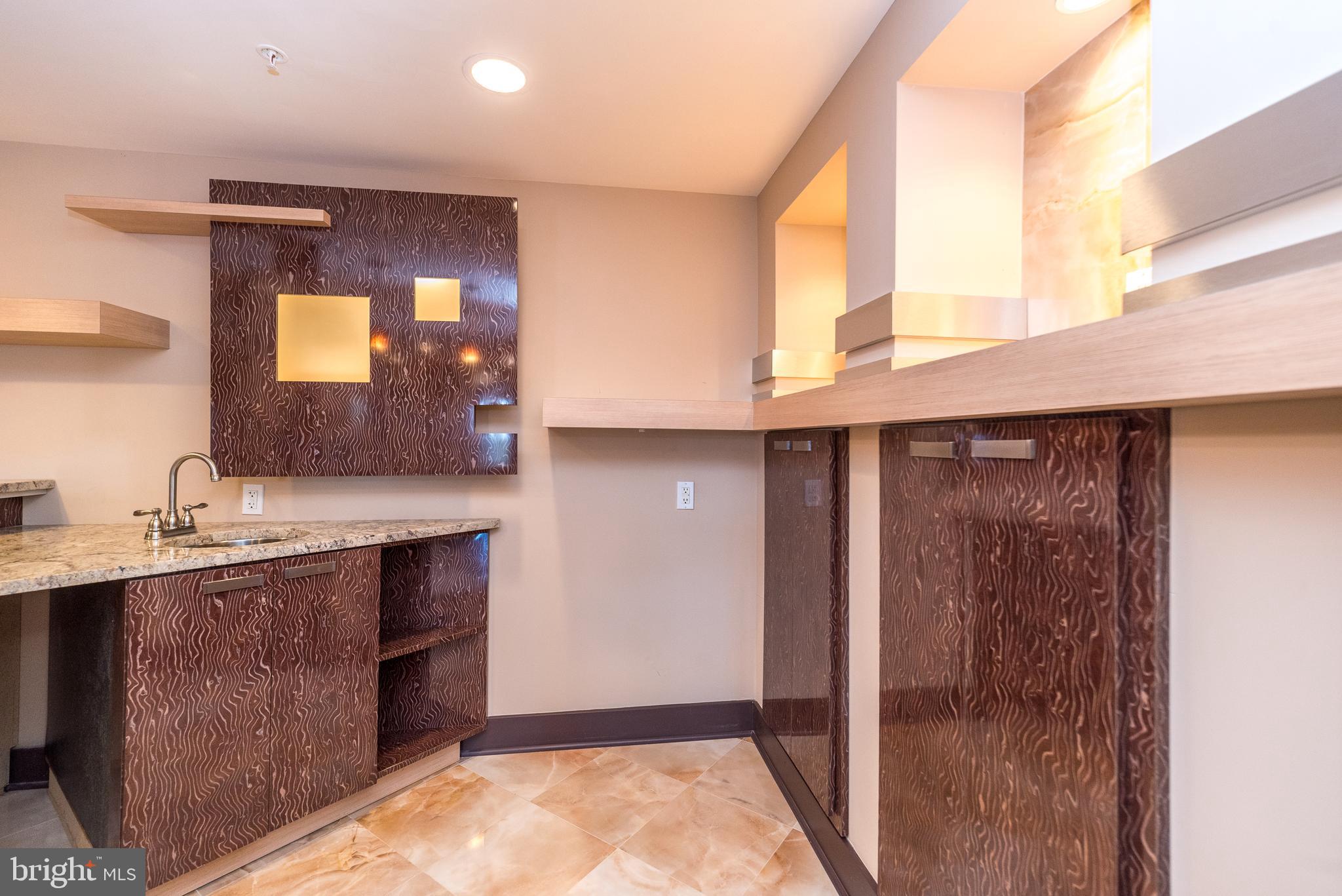 201 Summer Ridge Circle Chalfont, PA 18914 - Photo 77 of 94 A sink behind the bar and plenty of storage