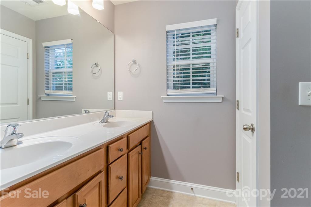 101 Old Meadowbrook Road Mooresville, NC 28115 - Photo 11 of 18 a bathroom with a sink and a window