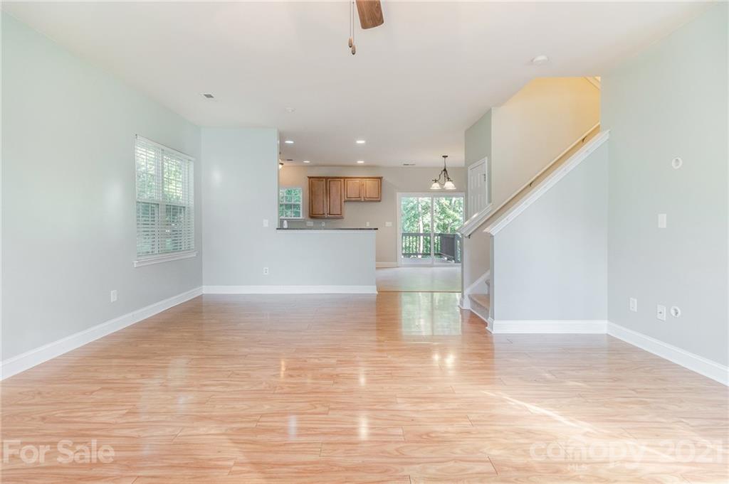 101 Old Meadowbrook Road Mooresville, NC 28115 - Photo 3 of 18 a view of empty room with wooden floor and fan