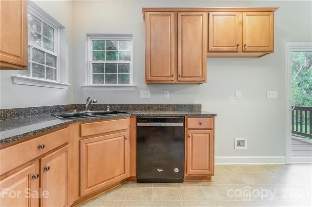 101 Old Meadowbrook Road Mooresville, NC 28115 - Photo 6 of 18 a kitchen with stainless steel appliances granite countertop a stove and a sink