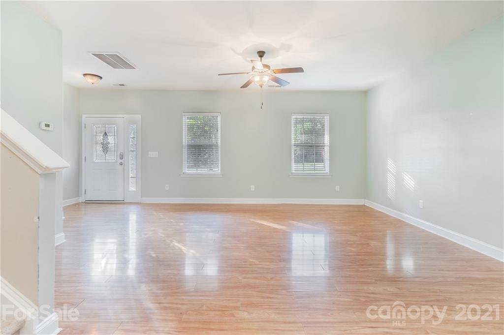 101 Old Meadowbrook Road Mooresville, NC 28115 - Photo 9 of 18 a view of a livingroom with a chandelier