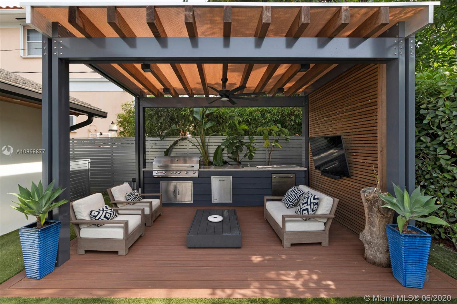 677 Ridgewood Road Key Biscayne, FL 33149 - Photo 14 of 38 a outdoor living space with furniture and garden view