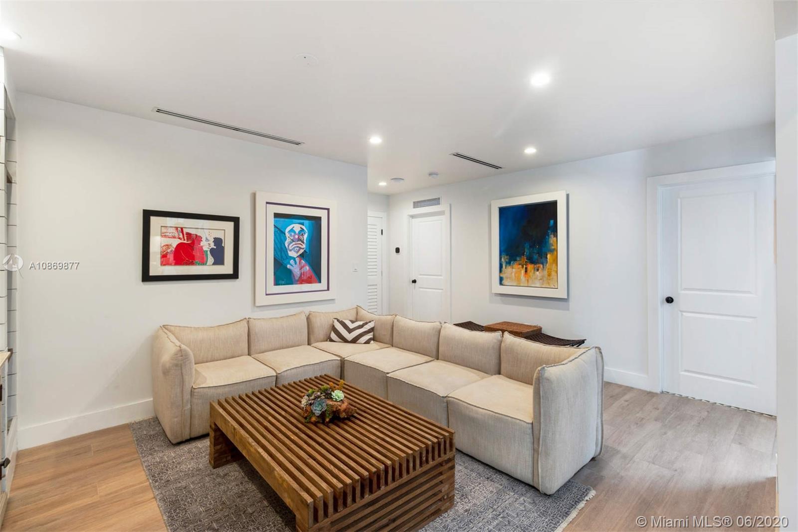 677 Ridgewood Road Key Biscayne, FL 33149 - Photo 17 of 38 a living room with furniture and a wooden floor