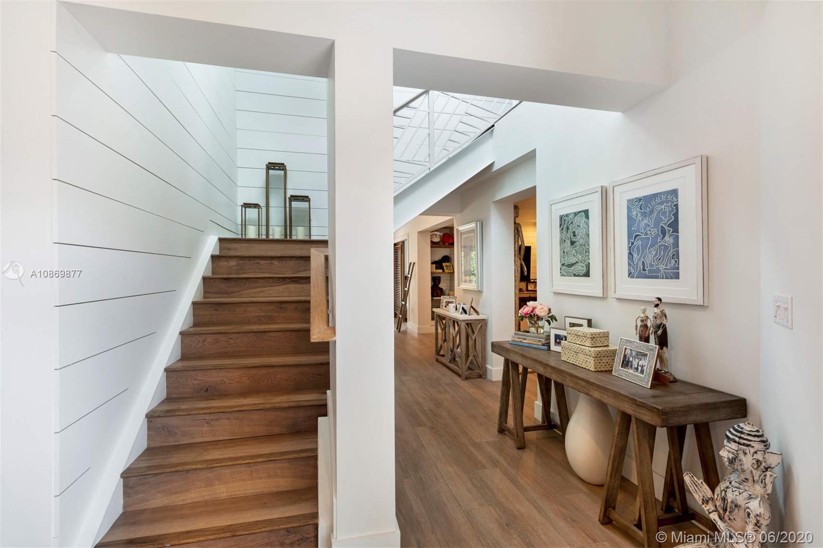 677 Ridgewood Road Key Biscayne, FL 33149 - Photo 24 of 38 a view of entryway livingroom and hall with wooden floor