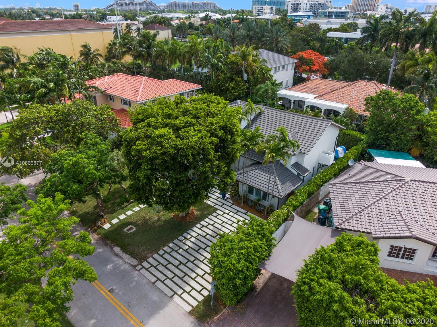 677 Ridgewood Road Key Biscayne, FL 33149 - Photo 32 of 38 an aerial view of a house with outdoor space and lake view