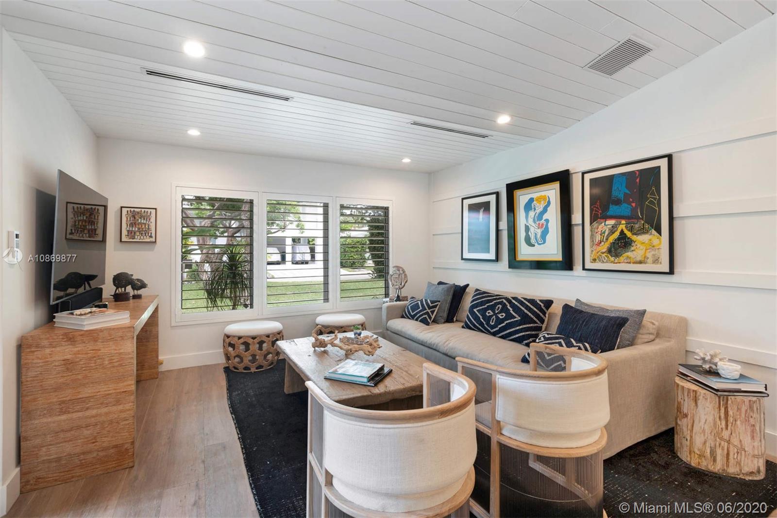 677 Ridgewood Road Key Biscayne, FL 33149 - Photo 4 of 38 a living room with furniture and wooden floor