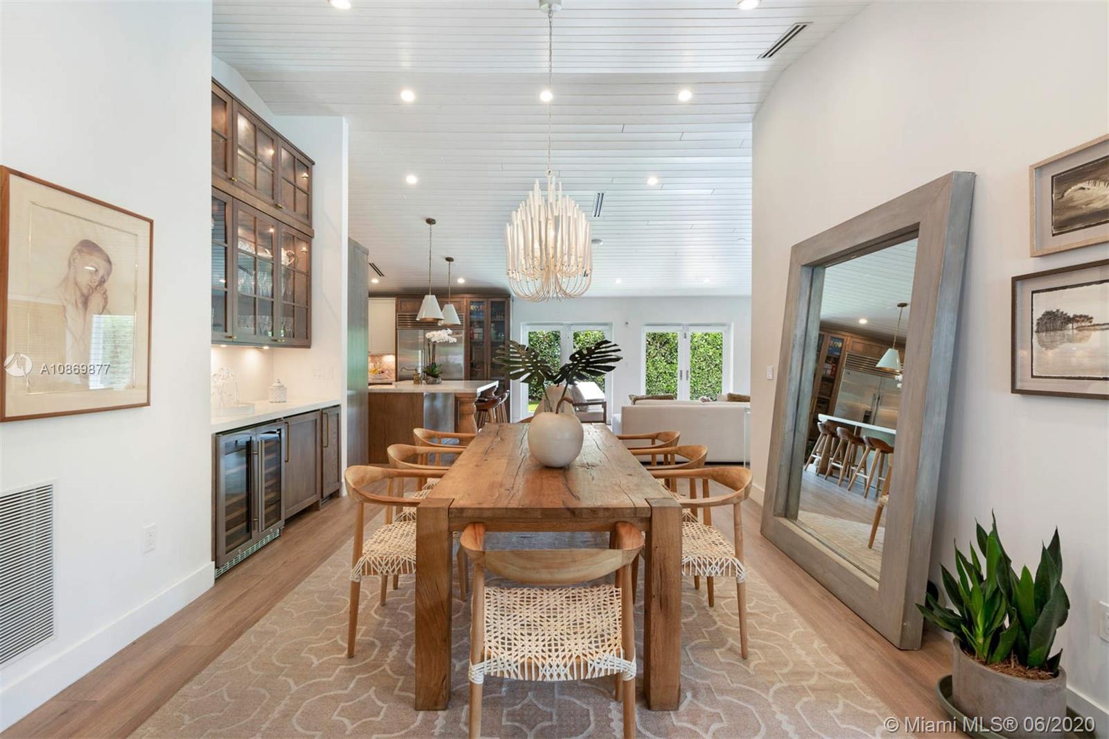 677 Ridgewood Road Key Biscayne, FL 33149 - Photo 5 of 38 a dining room with furniture and window