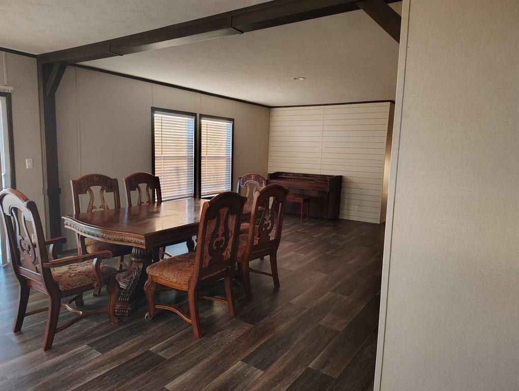 531 Blair Road Waxahachie, TX 75165 - Photo 5 of 40 Dining room featuring dark wood-style floors and beamed ceiling