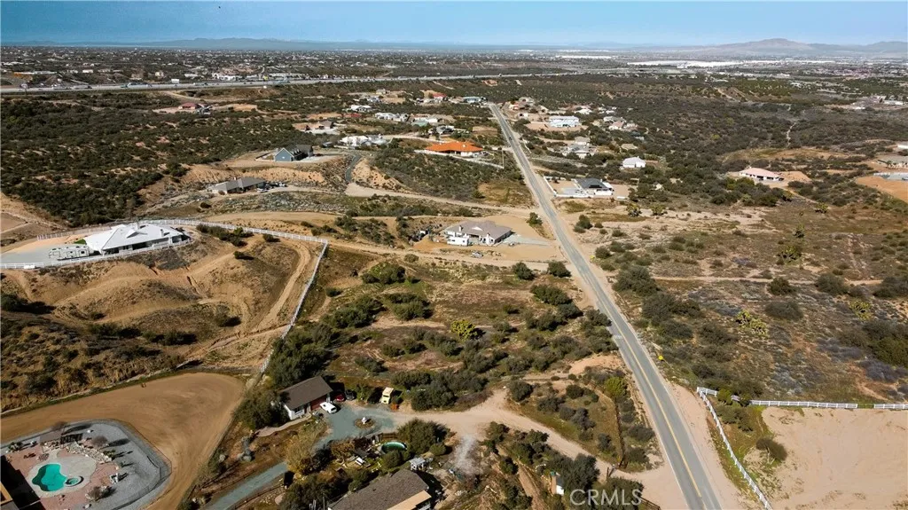 0 Coleridge Road Oak Hills, CA 92344 - Photo 9 of 22 an aerial view of residential houses with city view