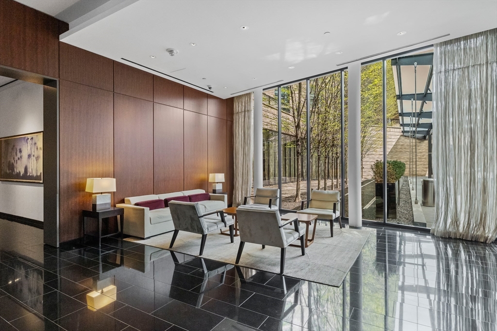 580 Washington Street, Unit 411 Boston, MA 02111 - Photo 18 of 24 a view of a dining room with furniture window and outside view