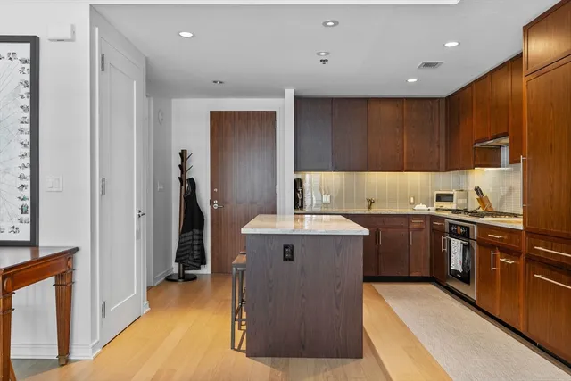 a kitchen with a sink stove and refrigerator