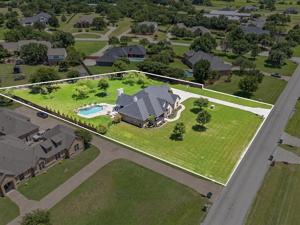 111 Old Base Road Aurora, TX 76078 - Photo 37 of 38 Beautifully updated custom home situated on a one-acre lot in Aurora Vista with mature landscaping, stone accents, and exceptional curb appeal.