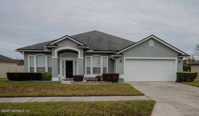 a front view of a house with garage