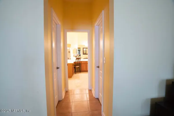 a view of a room with furniture and a window